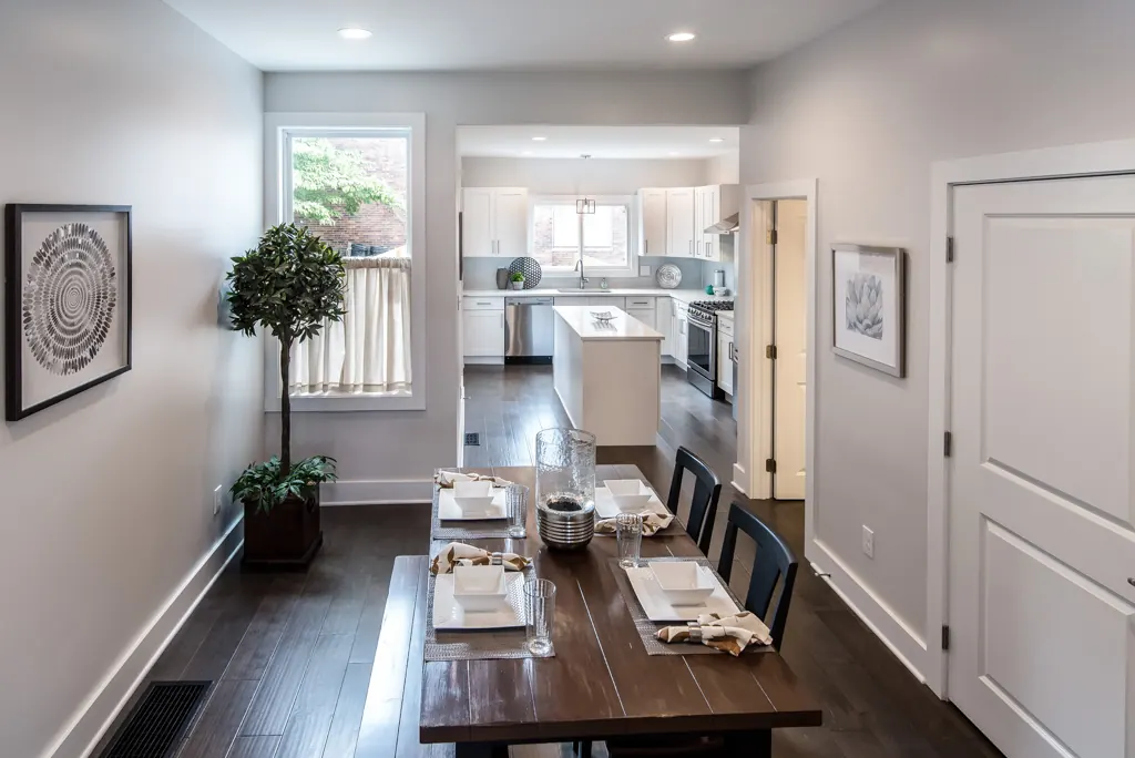 Finished Milwaukee renovation by Happy Construction, dining room opened to the kitchen